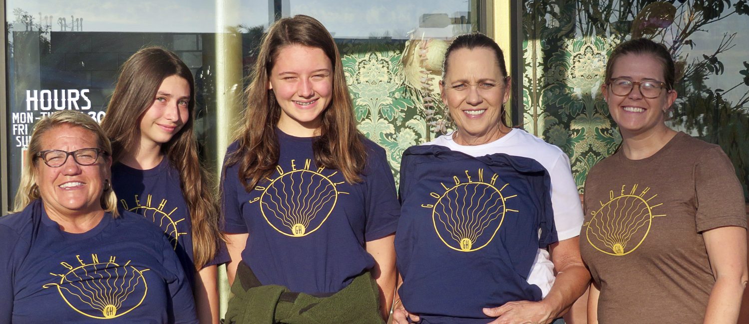 Golden Hill Members Holding T-Shirts